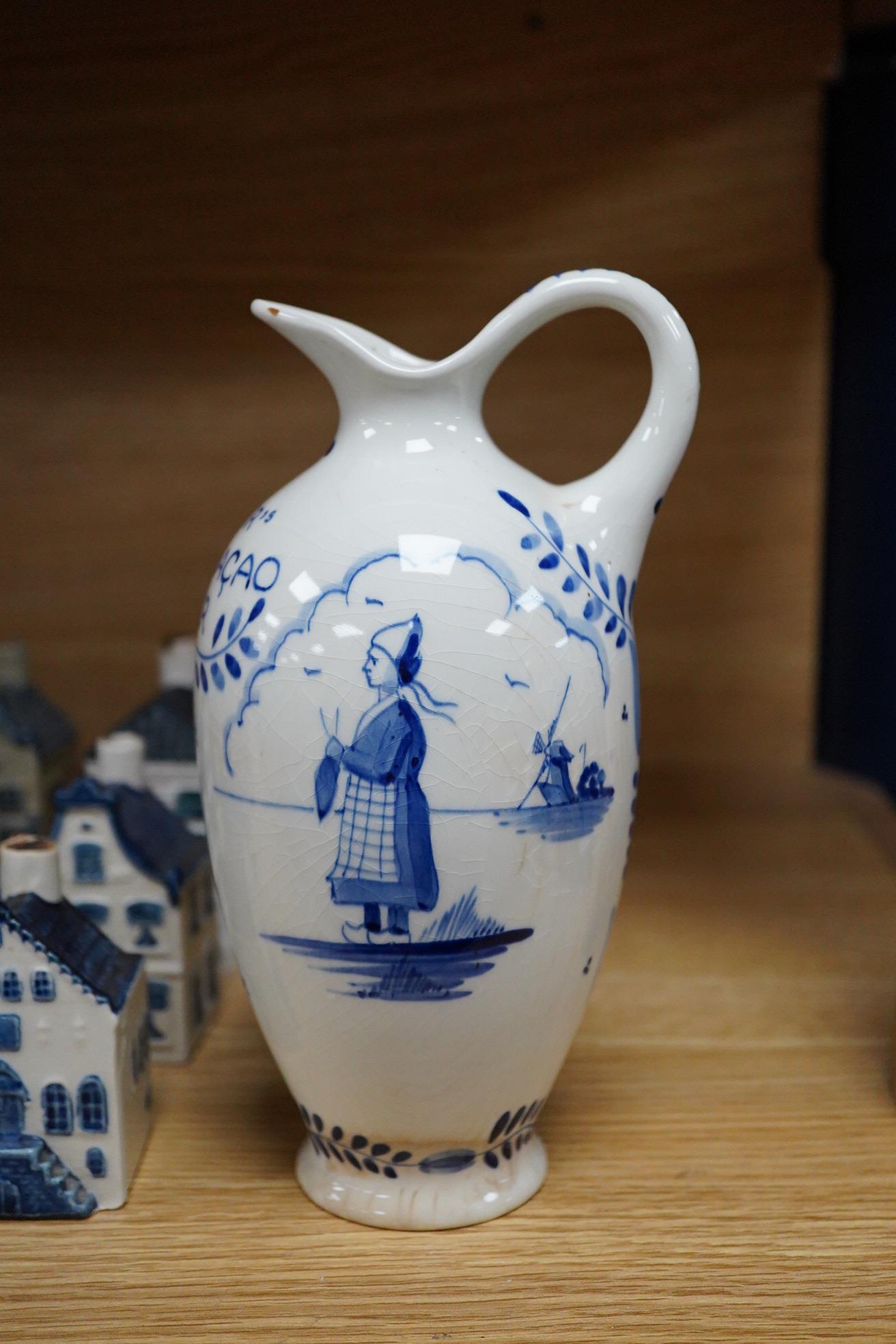 A collection of twenty seven KLM Delft blue miniature houses presented to Business class passengers together with a Delft jug - 20.5cm high